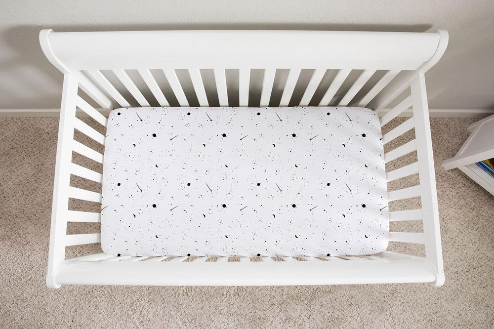 Ely’s & Co. celestial print crib sheet, easy-care for busy parents.