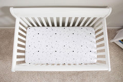 Ely’s & Co. celestial print crib sheet, easy-care for busy parents.