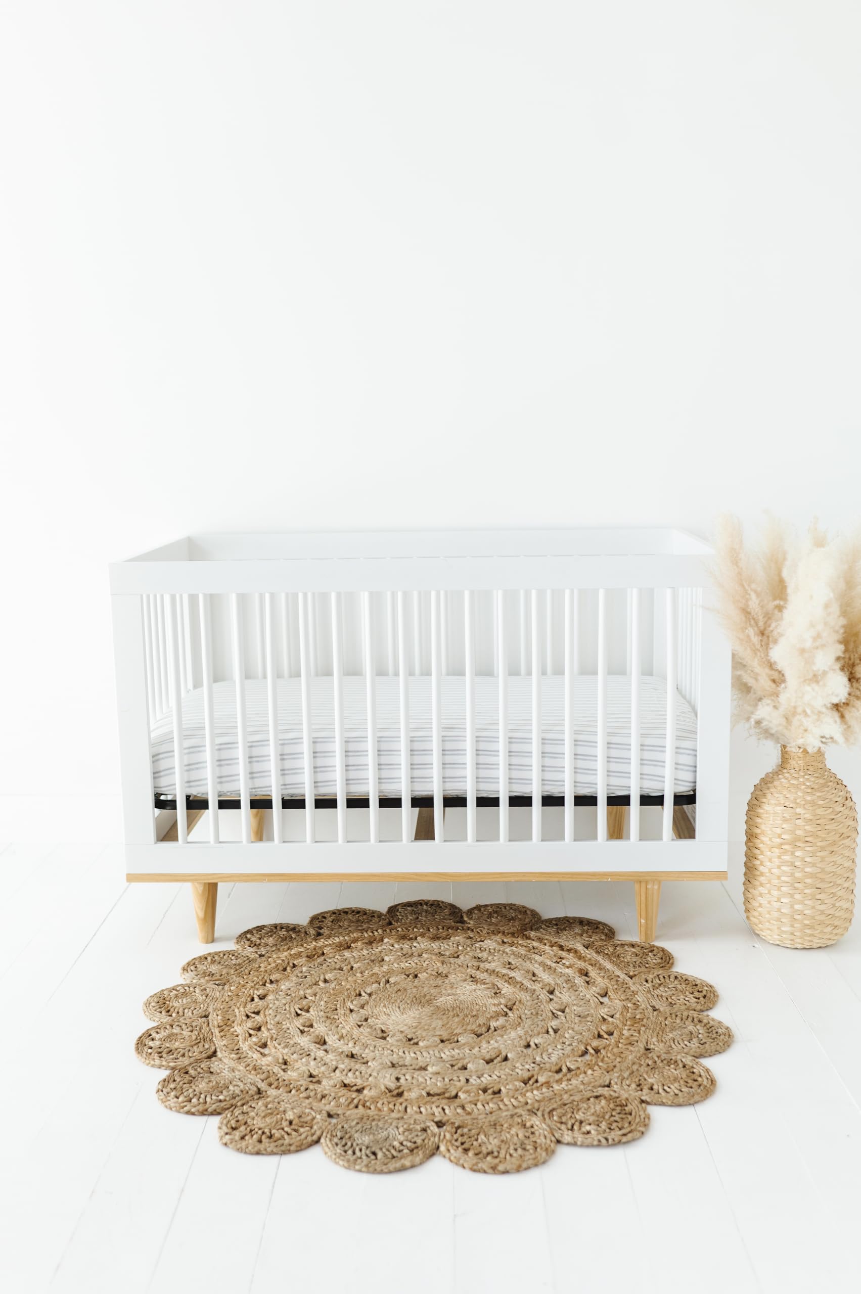 Ely's & Co. stripes blue crib sheet—transition-ready for toddler beds.