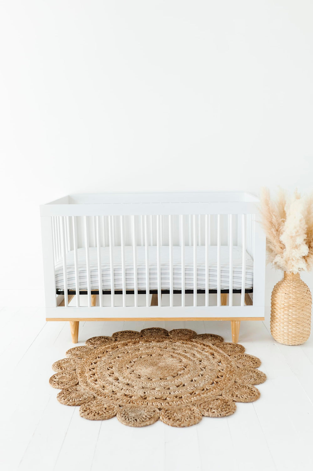 Ely's & Co. stripes blue crib sheet—transition-ready for toddler beds.