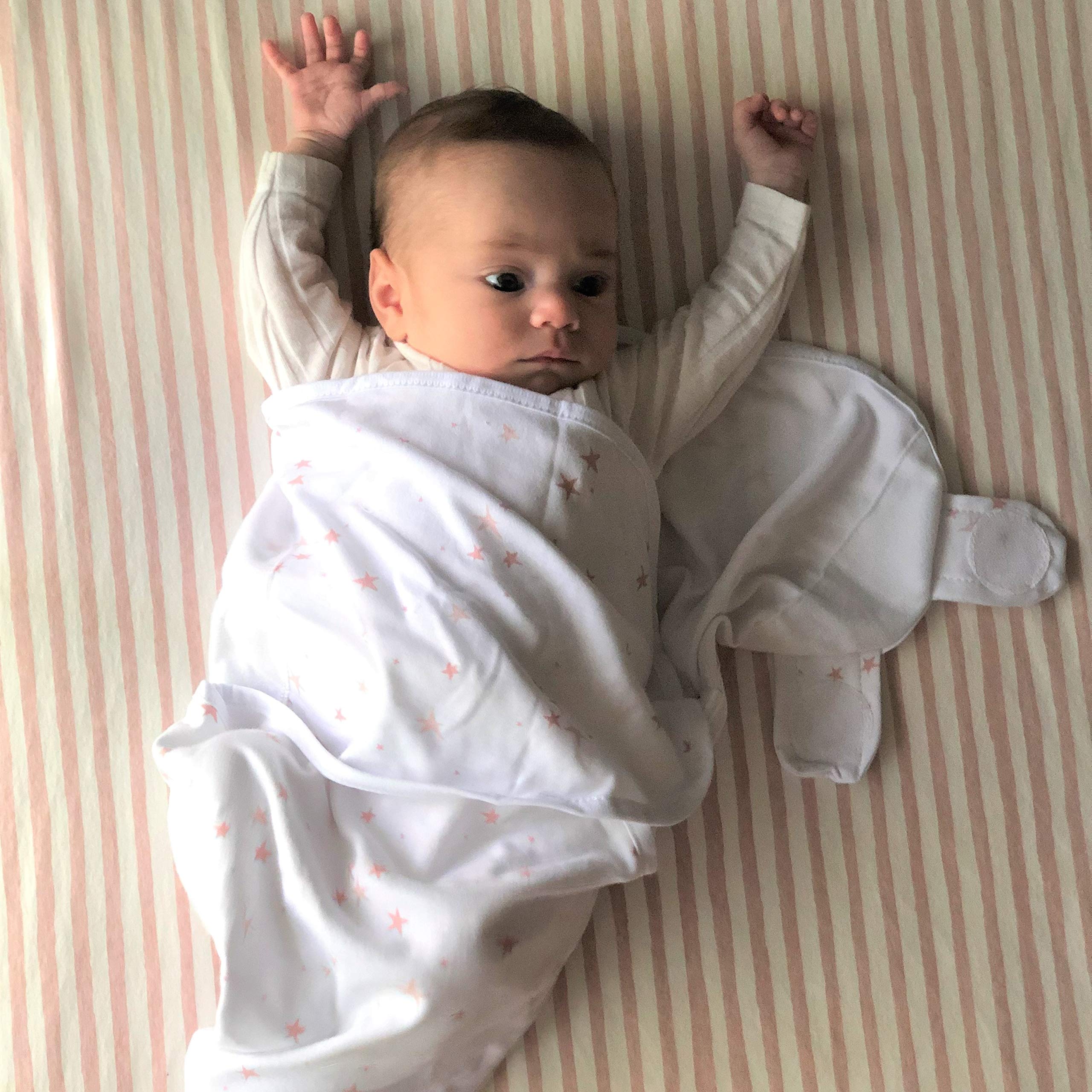 Dusty rose and mauve pink star design on Ely's & Co swaddles