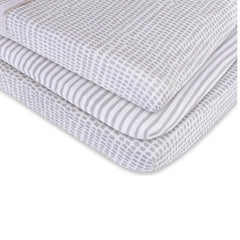 Flexible elastic-band fit keeps the cover snug on changing pads and cradle mattresses.
