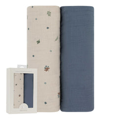 Ely's & Co solid blue muslin swaddle blanket, breathable and cozy.