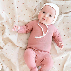 Ely's & Co. muslin swaddle solid pink blanket for versatile baby use.