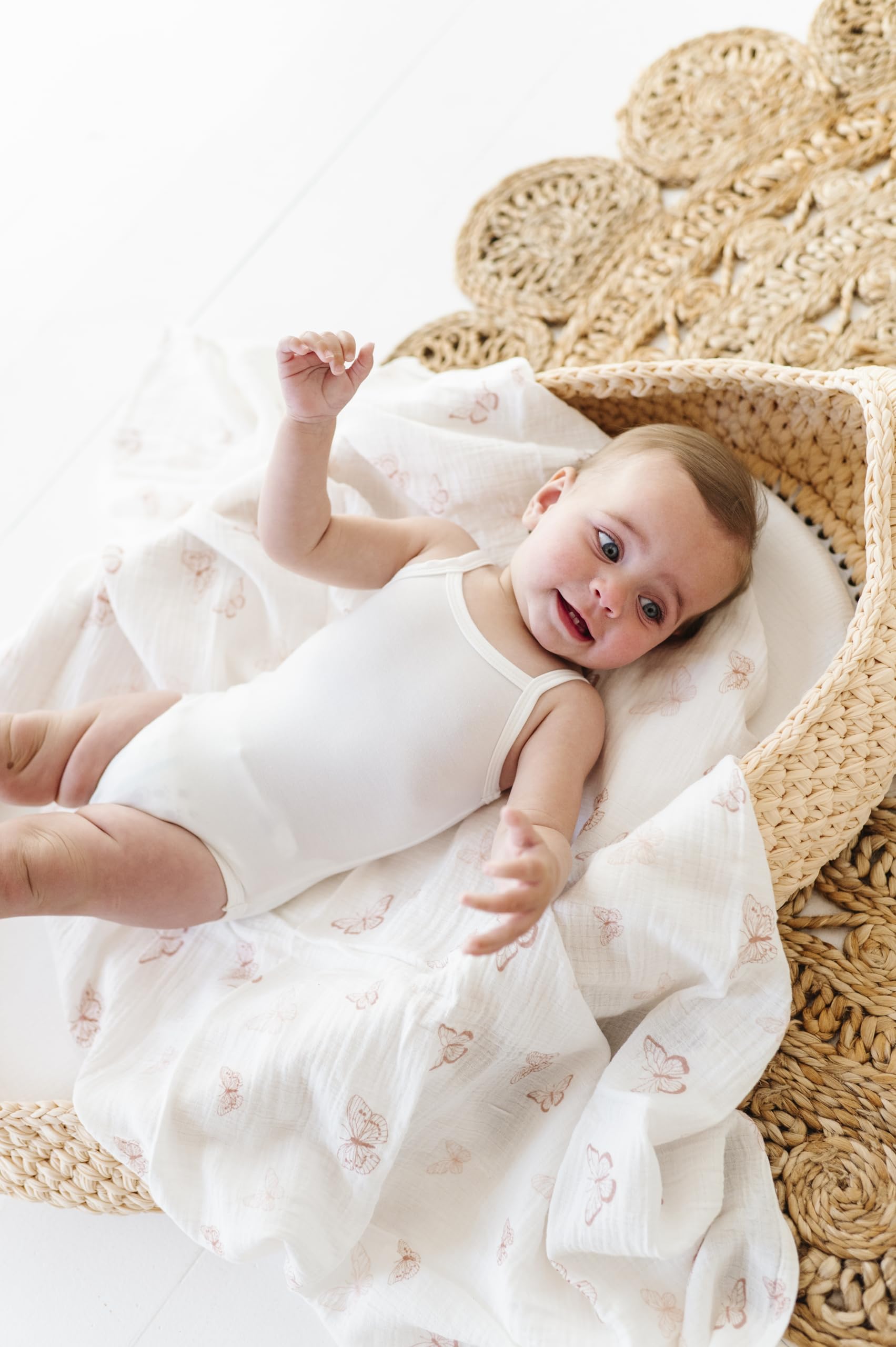 Ely's & Co. swaddle blankets shown on a baby, ideal as a stroller cover.