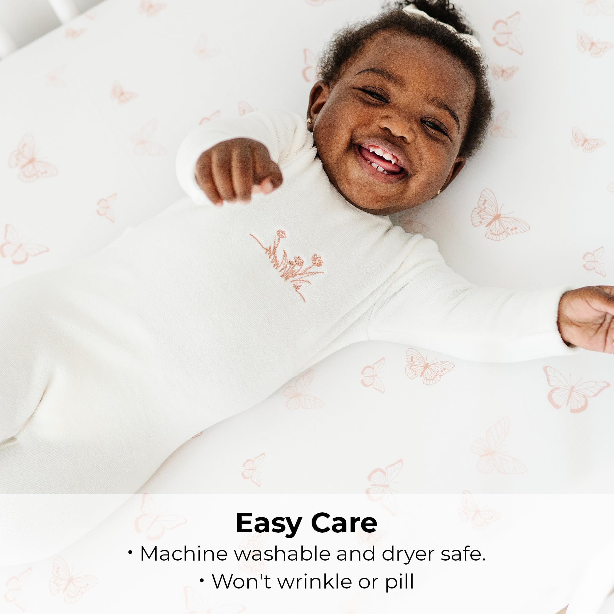 Nursery-ready Ely's & Co Pack and Play sheets in pink butterfly and stripe design