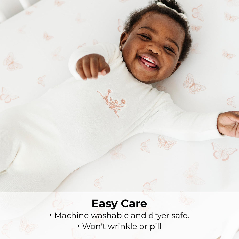 Nursery-ready Ely's & Co Pack and Play sheets in pink butterfly and stripe design