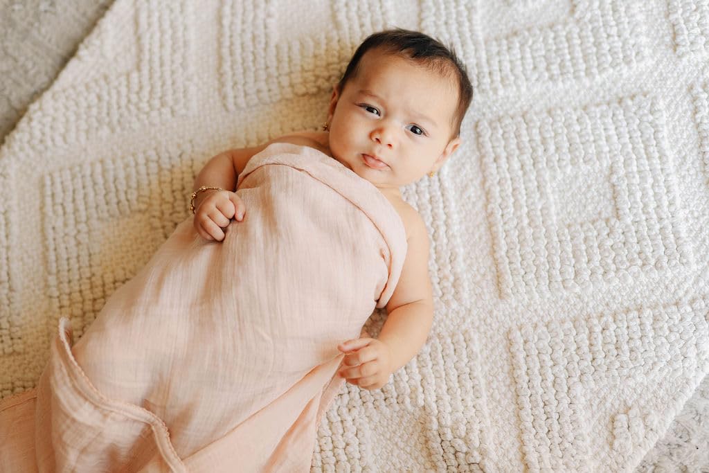 Ely's & Co swaddle blanket close-up highlights breathable muslin weave for comfortable sleep.