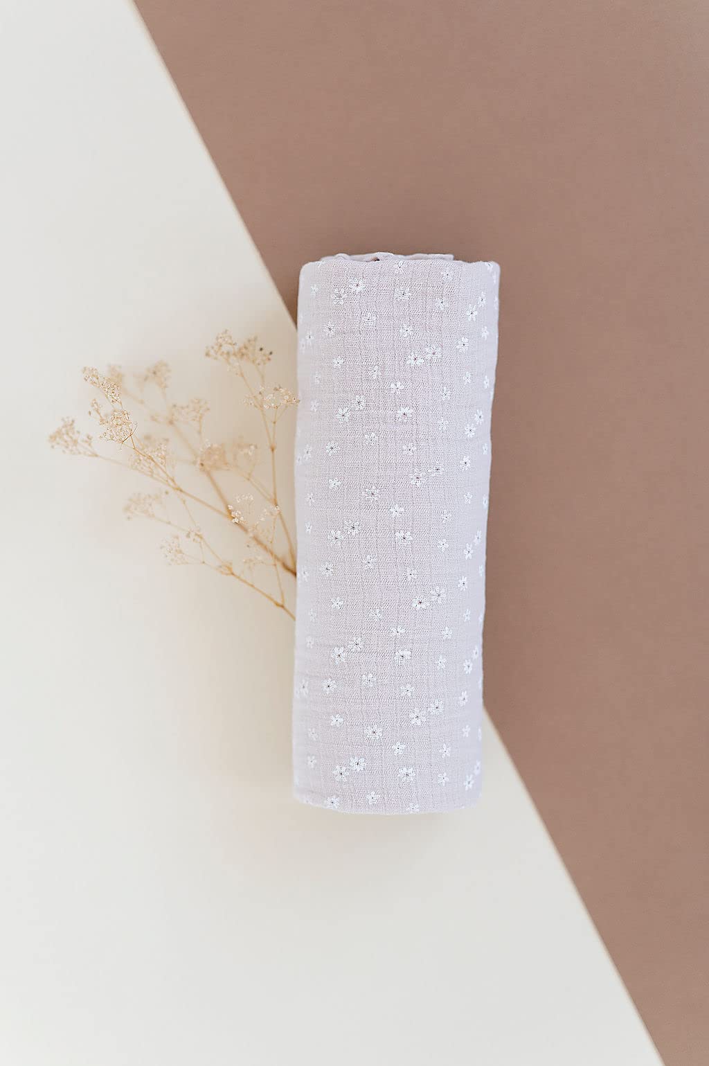 Versatile Ely's & Co. swaddle blanket as nursing cover and car seat shade