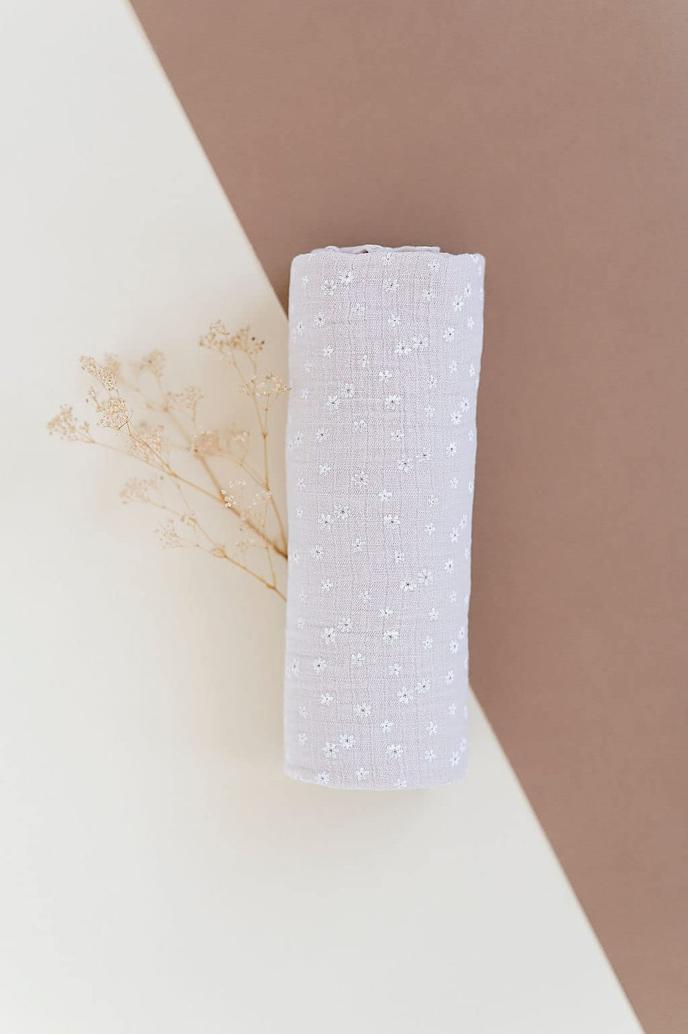 Versatile Ely's & Co. swaddle blanket as nursing cover and car seat shade