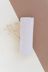 Versatile Ely's & Co. swaddle blanket as nursing cover and car seat shade