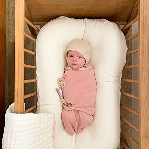 Two-pack Ely's & Co swaddles in mauve pink star design for easy naps