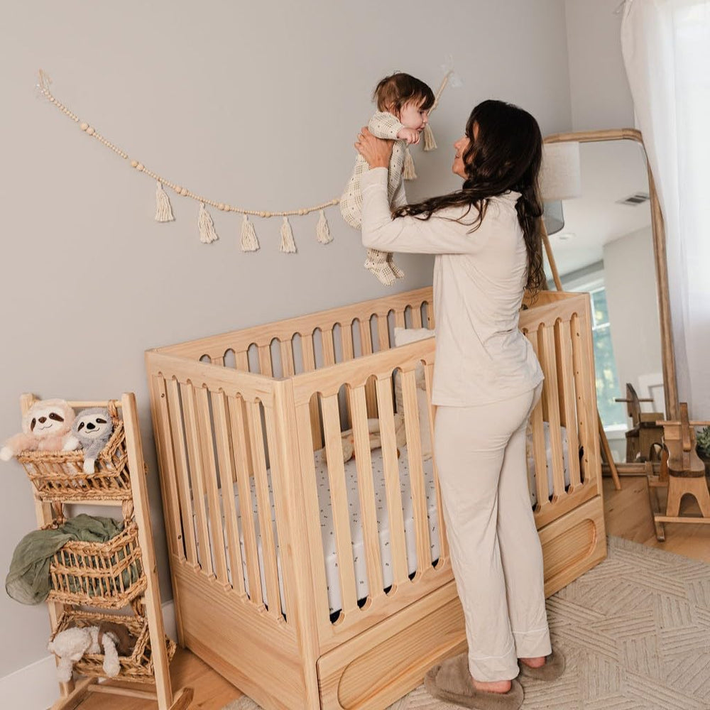 Machine washable and dryer safe Ely's & Co waterproof crib sheets