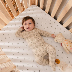 Ely's & Co crib sheet with snug elastic band stays in place during use