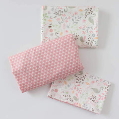 Emenpy Swan-pattern crib fitted sheet with snug fit on a standard mattress.