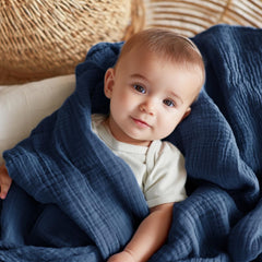 EMME muslin baby blanket navy in stroller highlights lightweight all-season comfort