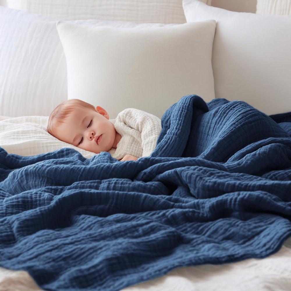 EMME muslin baby blanket navy wrap demonstrates versatile swaddle and nursing cover