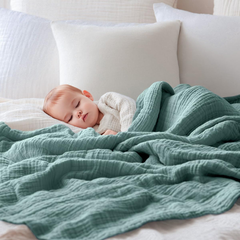 EMME muslin baby blanket teal close-up highlights 4-layer gauze softness