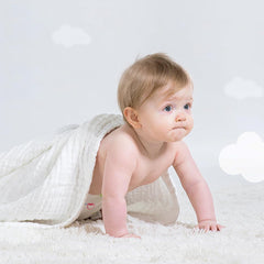 EMME muslin blanket care guide shows machine wash and quick dry