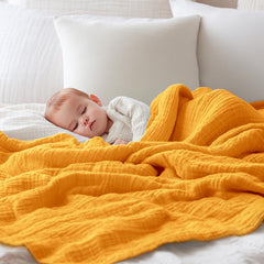 EMME Muslin nursing cover provides lightweight privacy during feeding.