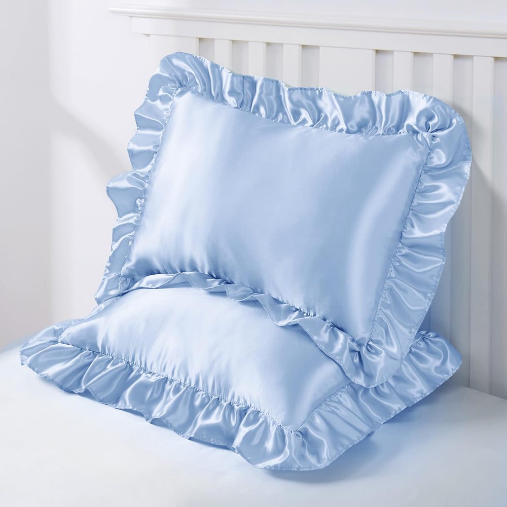 Entisn Baby Blue pillowcase draped on a toddler bed.