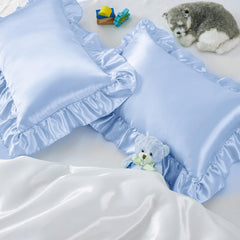 Entisn ruffle satin toddler pillowcase close-up showing silky texture.