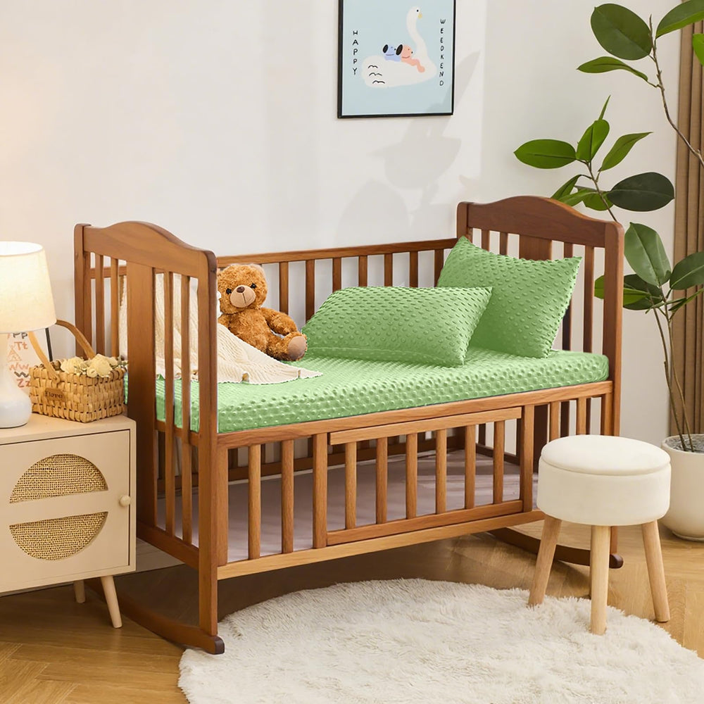 Entisn Sage Green nursery setup on crib for tranquil styling.