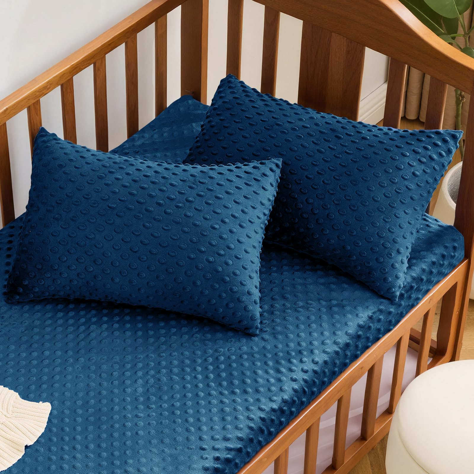 Cozy nursery scene with Entisn navy pillowcase for toddler bed