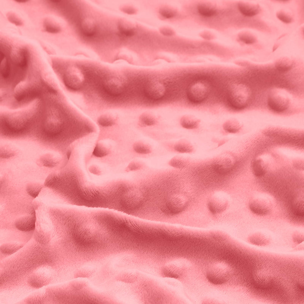 Entisn pink nursery scene showing pillowcase on a crib pillow