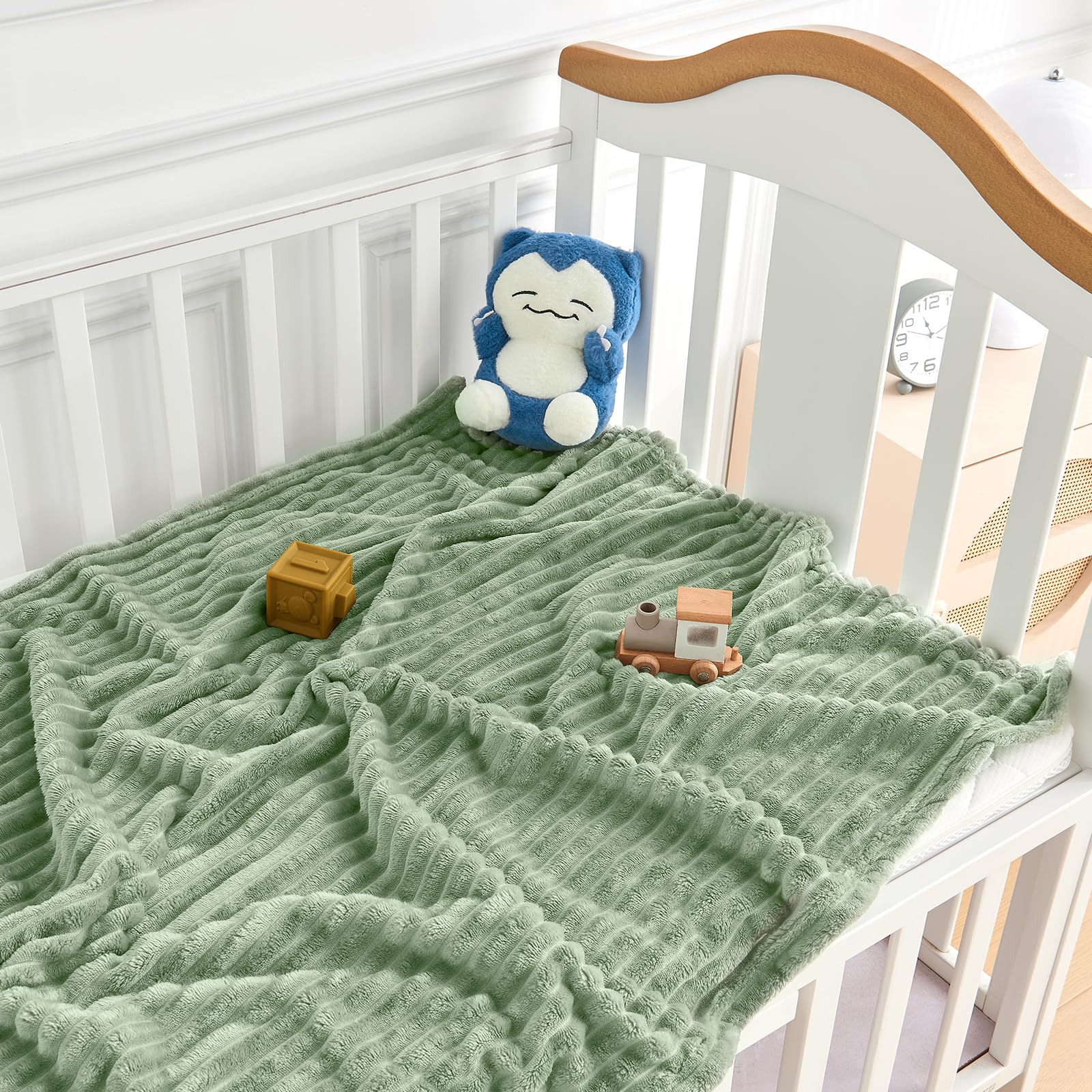 Eonkasp sage stripe blanket used in stroller outings
