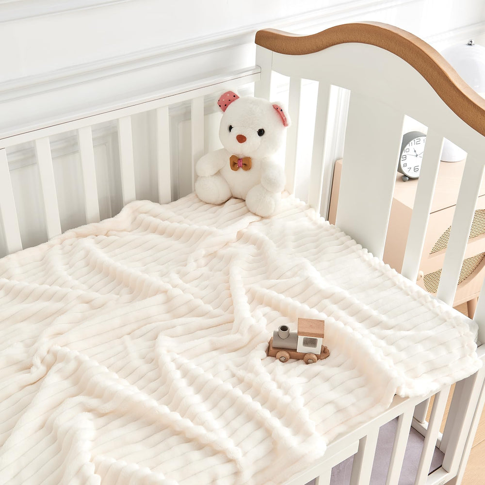 Eonkasp striped baby blanket on crib view with unisex pattern