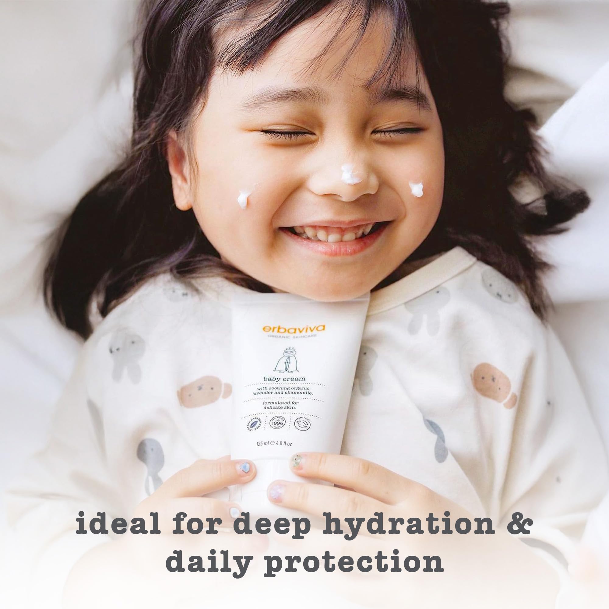 erbaviva Baby Cream applied to baby face for soothing moisture.