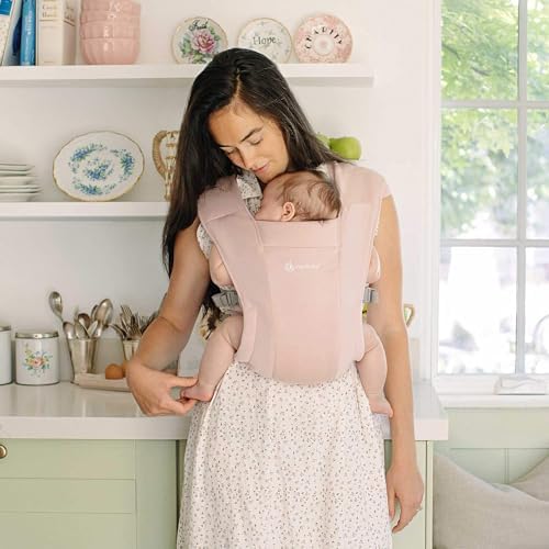 Ergobaby Embrace knit newborn mode demonstrates secure, cozy positioning for early days.