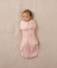ergoPouch Cocoon Swaddle Sack in use shows arms-out option for flexible sleep.