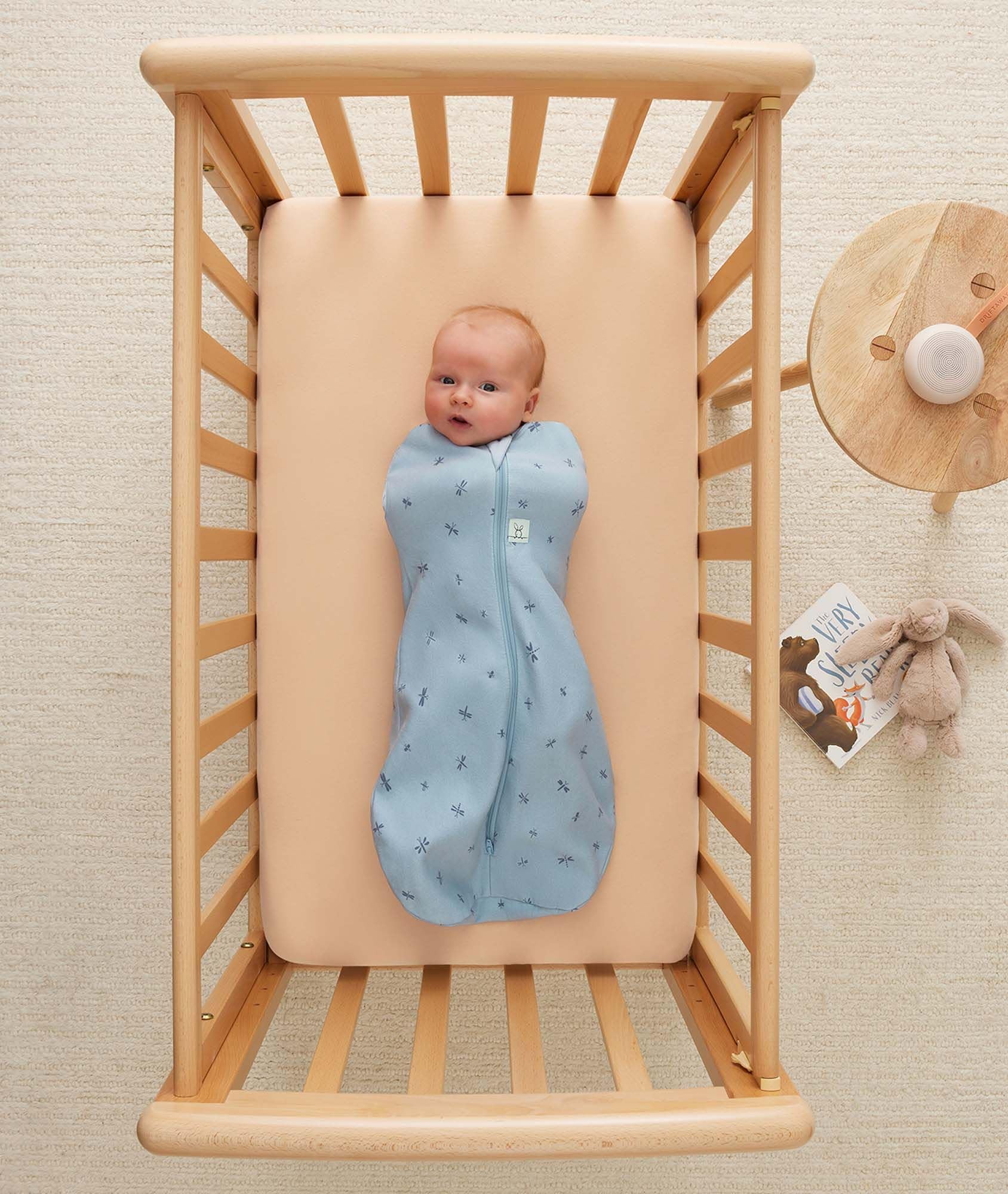 ergoPouch Cocoon Swaddle Sack shoulder-snaps enable smooth arm-in to arm-out transitions.