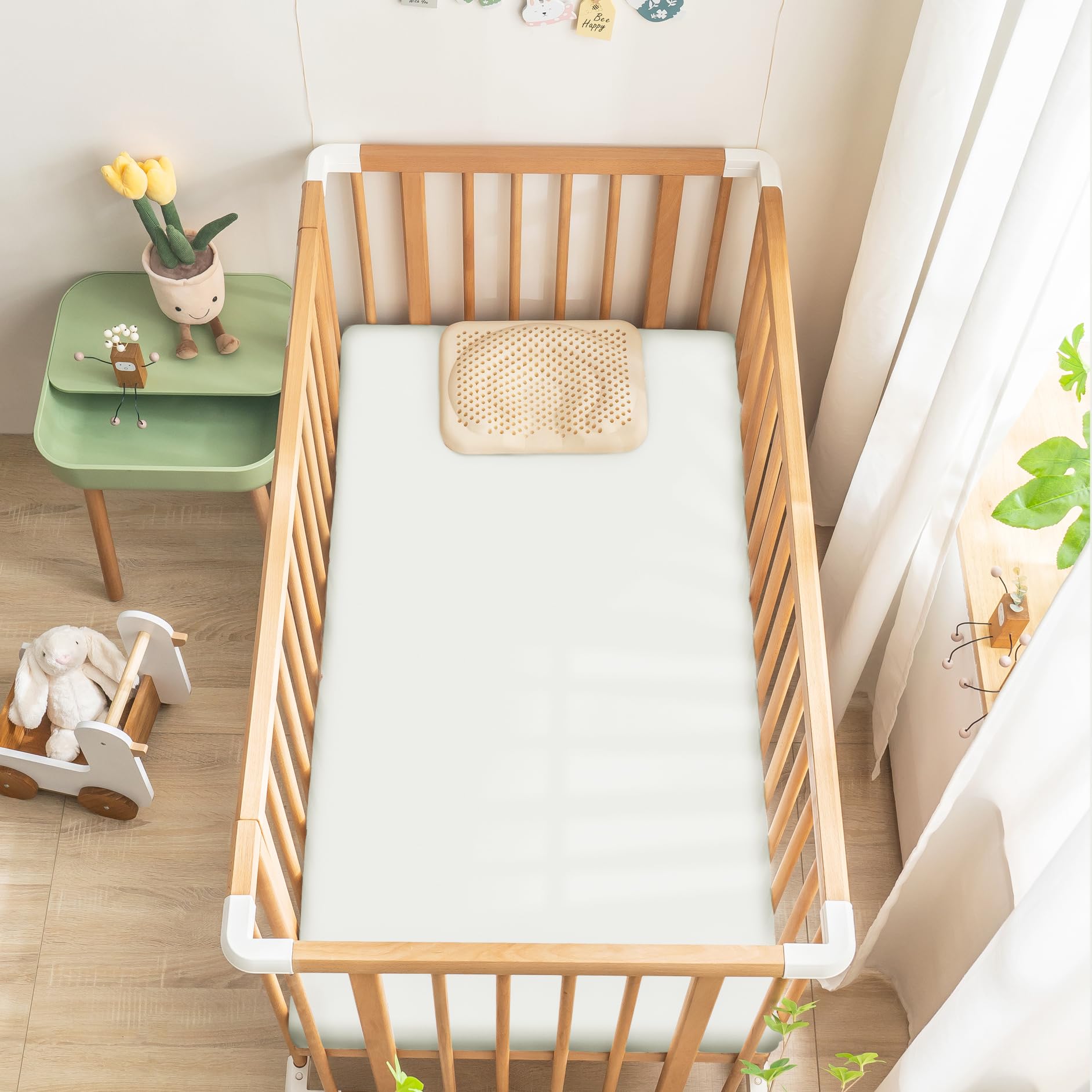 Ersmak satin crib sheet showing elastic bottom for a snug, secure fit