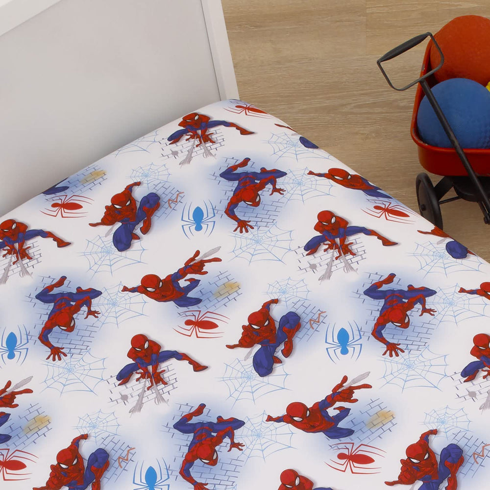 Vibrant Spiderman print on white fabric for nursery decor