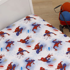 Vibrant Spiderman print on white fabric for nursery decor