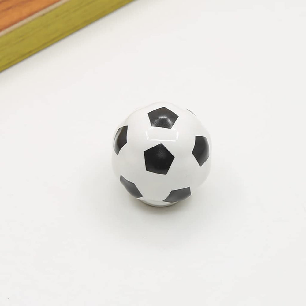ESreake kid-friendly soccer-themed knob adds playful décor to a room.