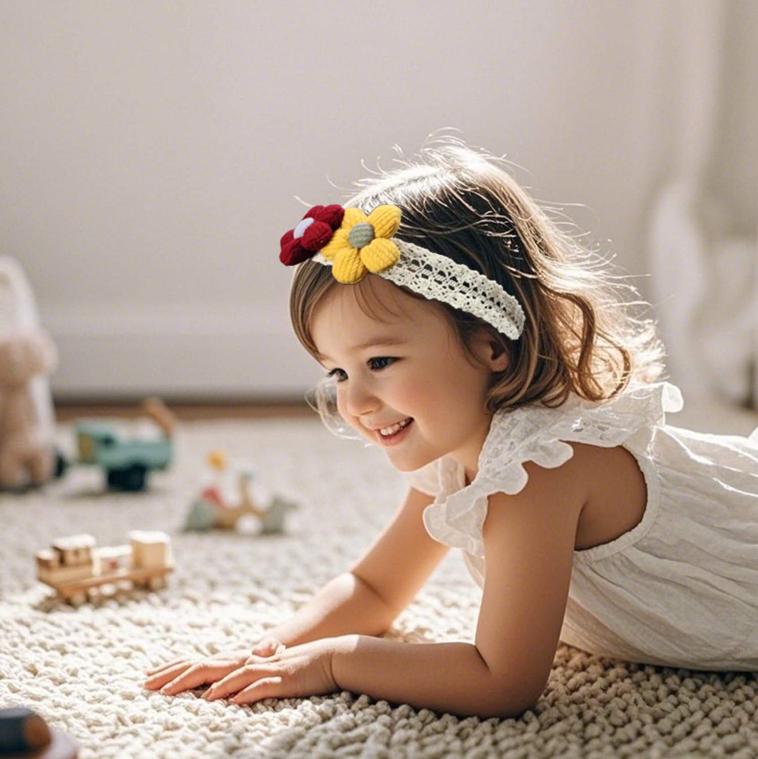 Esumun lace-detail headband offers gentle support during family photos.