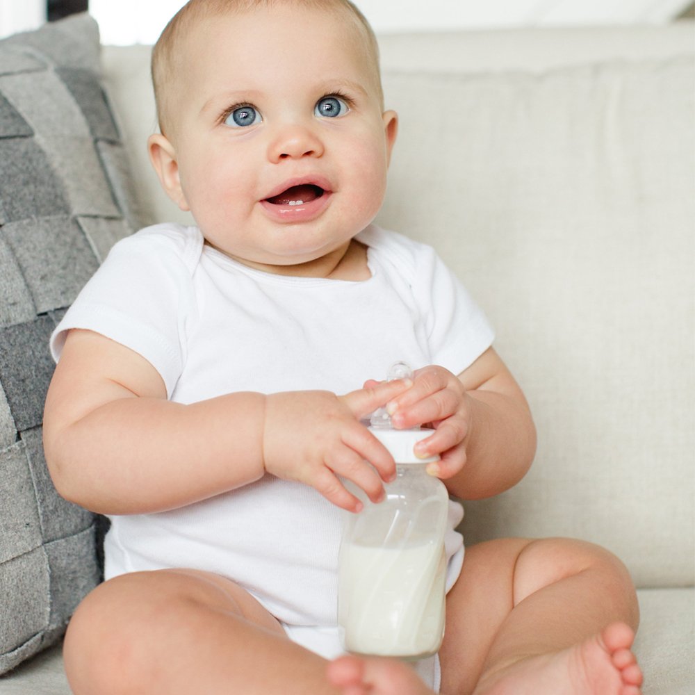 Ergonomic hold of Evenflo glass bottle reduces hand strain during feeding.