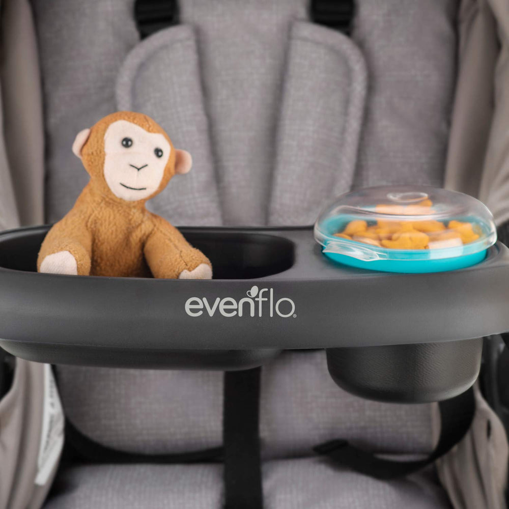 Evenflo Snack Cup inside tray showing secure fit