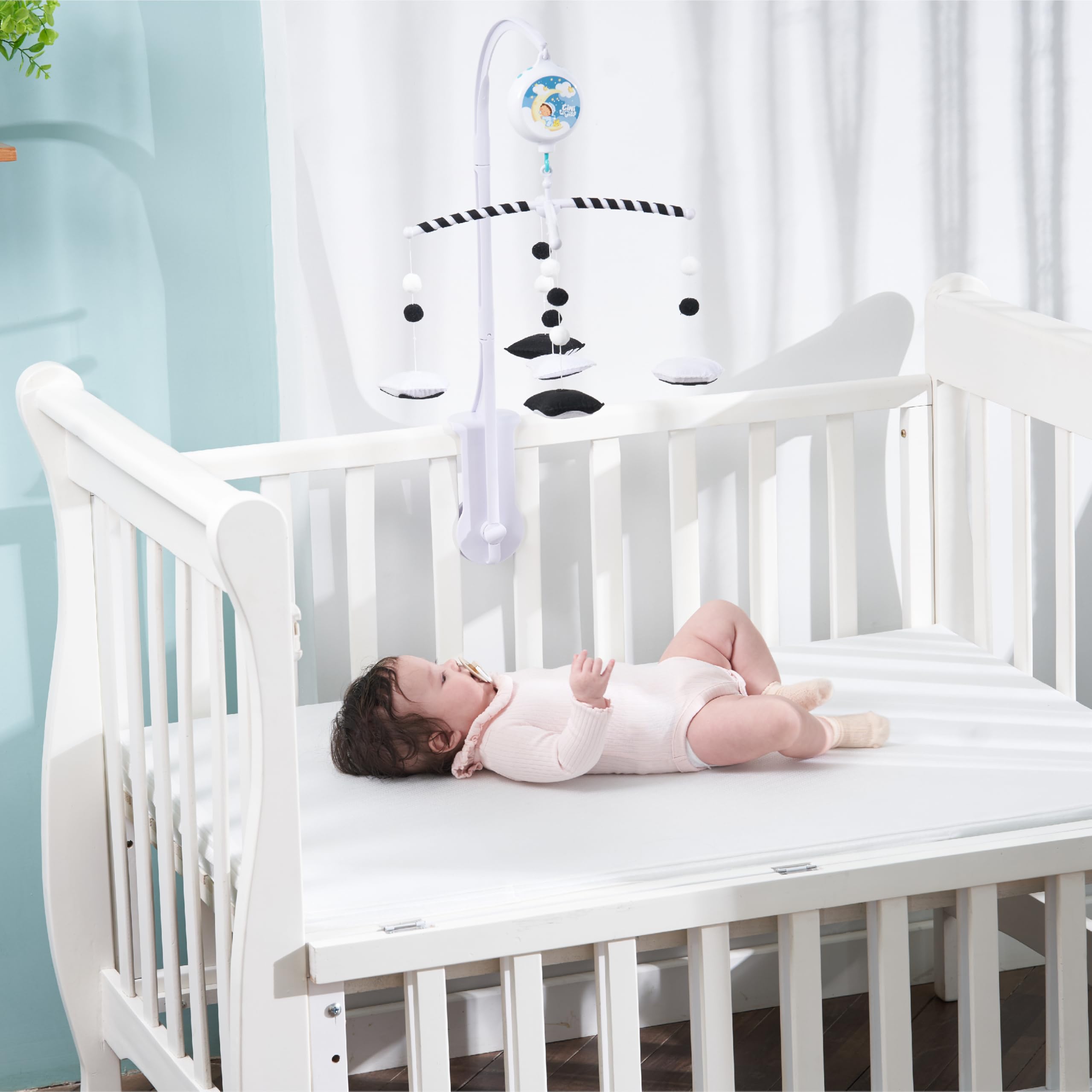 EverLove black and white mobile adds modern nursery decor appeal.