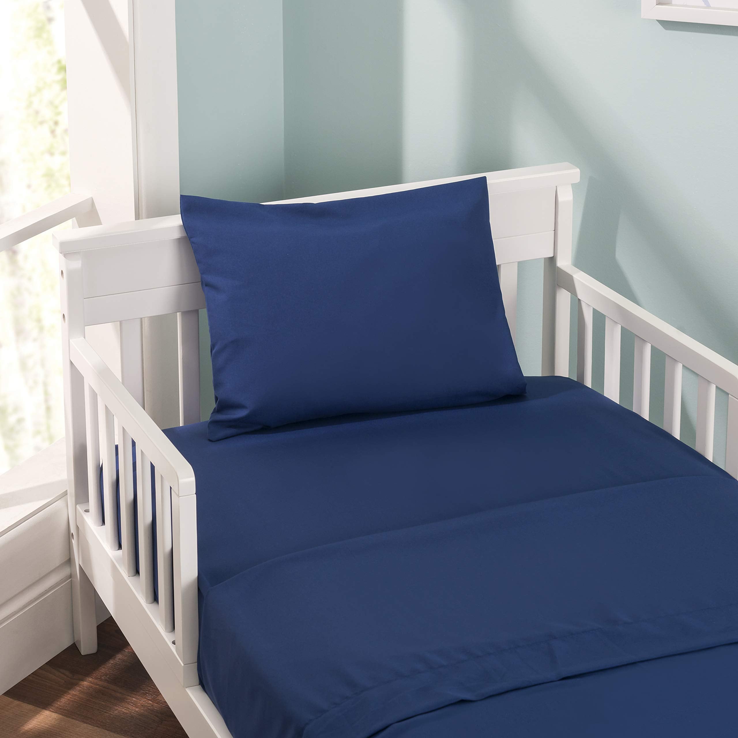 EVERYDAY KIDS navy pillowcase stitching detail enhances durability for daily use by toddlers.
