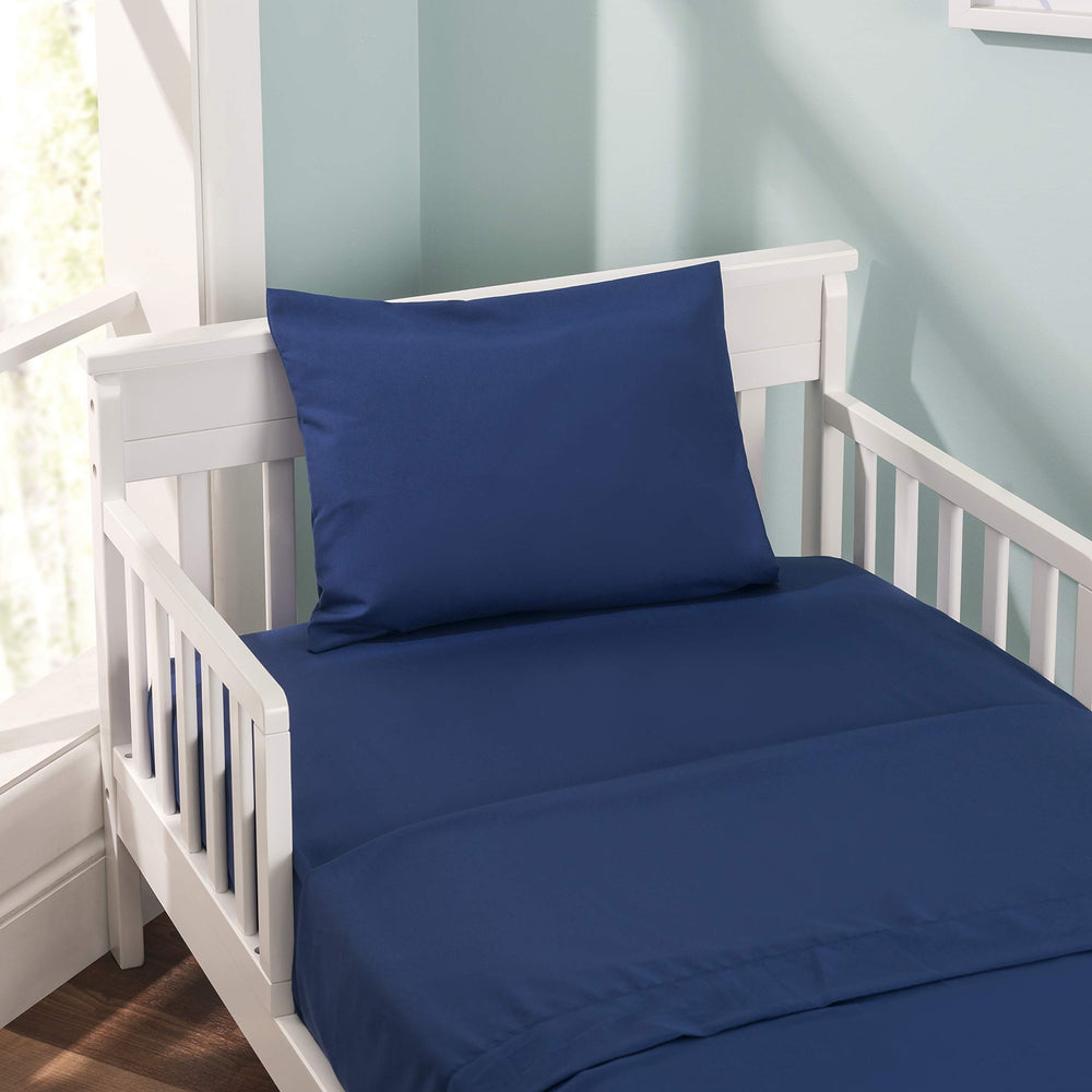 EVERYDAY KIDS navy pillowcase stitching detail enhances durability for daily use by toddlers.