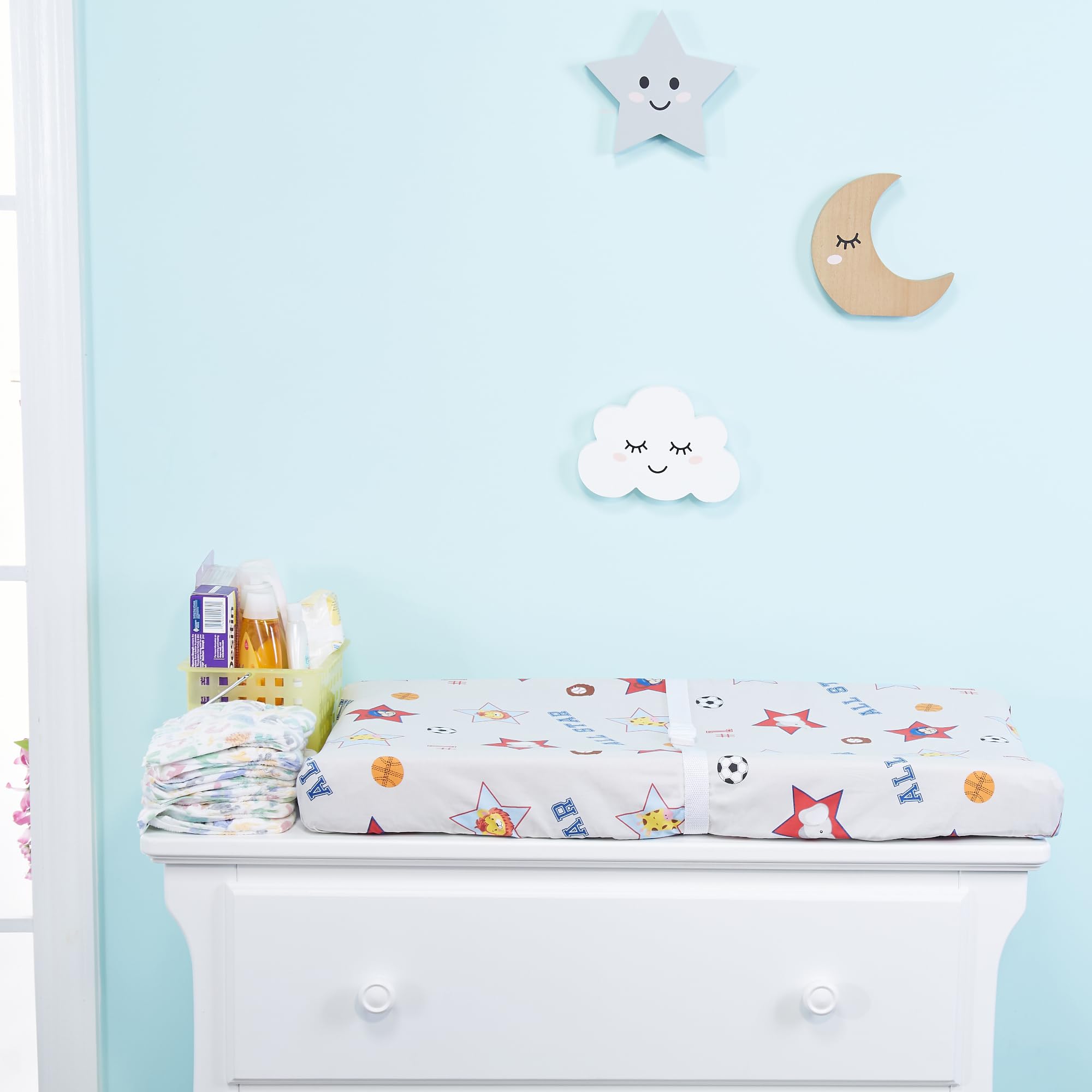 Everyday Kids blue solid cover shown in use provides a cozy diaper-changing surface.