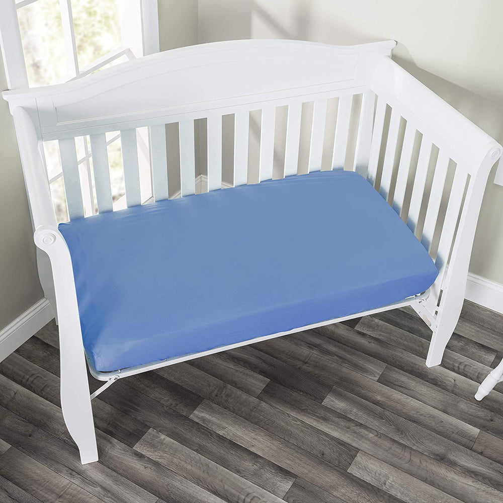 Everyday Kids fitted crib sheet with elastic trim demonstrates secure four-sided fit.