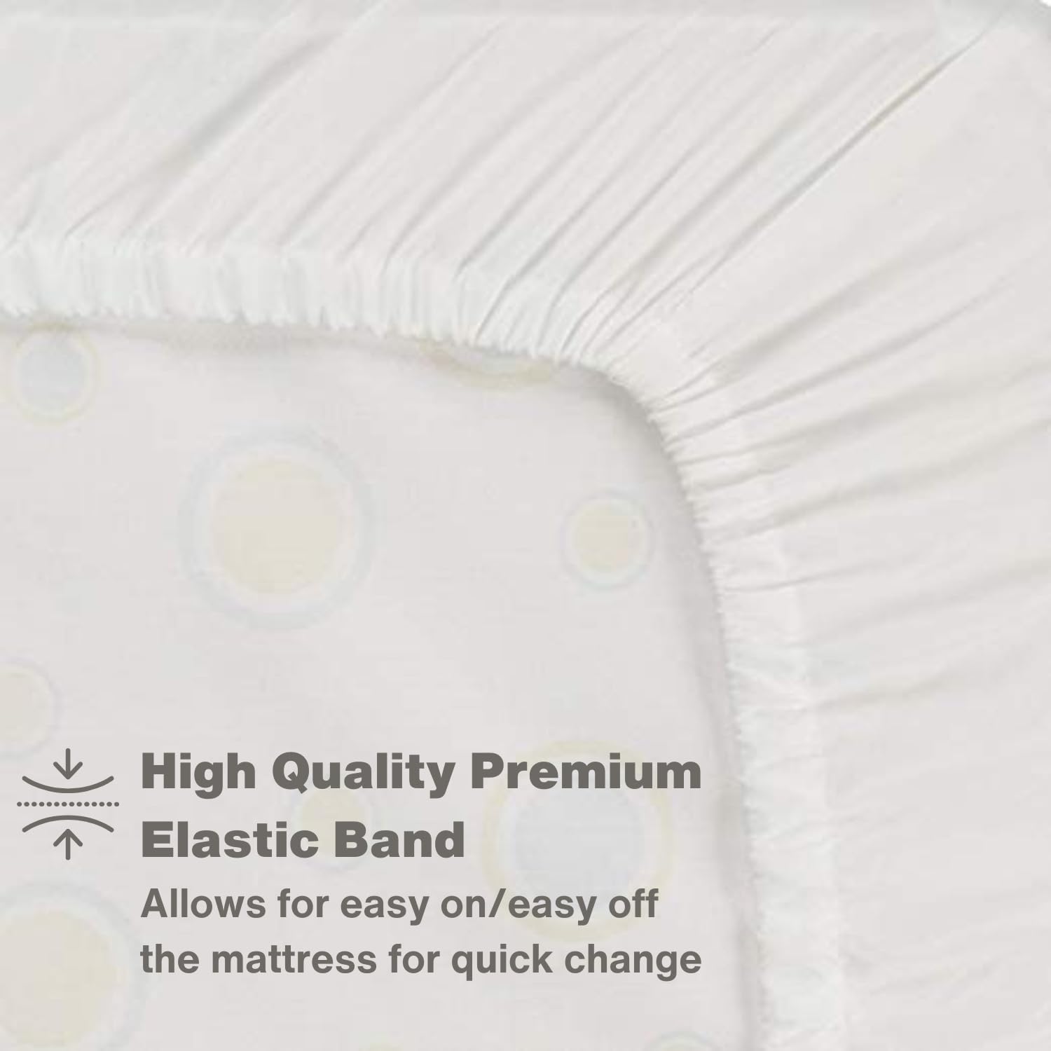 Everyday Kids white crib sheet on a standard 52x28 mattress in a nursery.