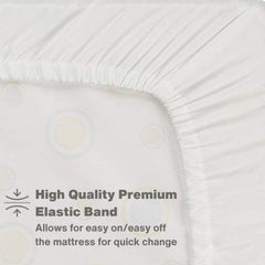 Everyday Kids white crib sheet on a standard 52x28 mattress in a nursery.