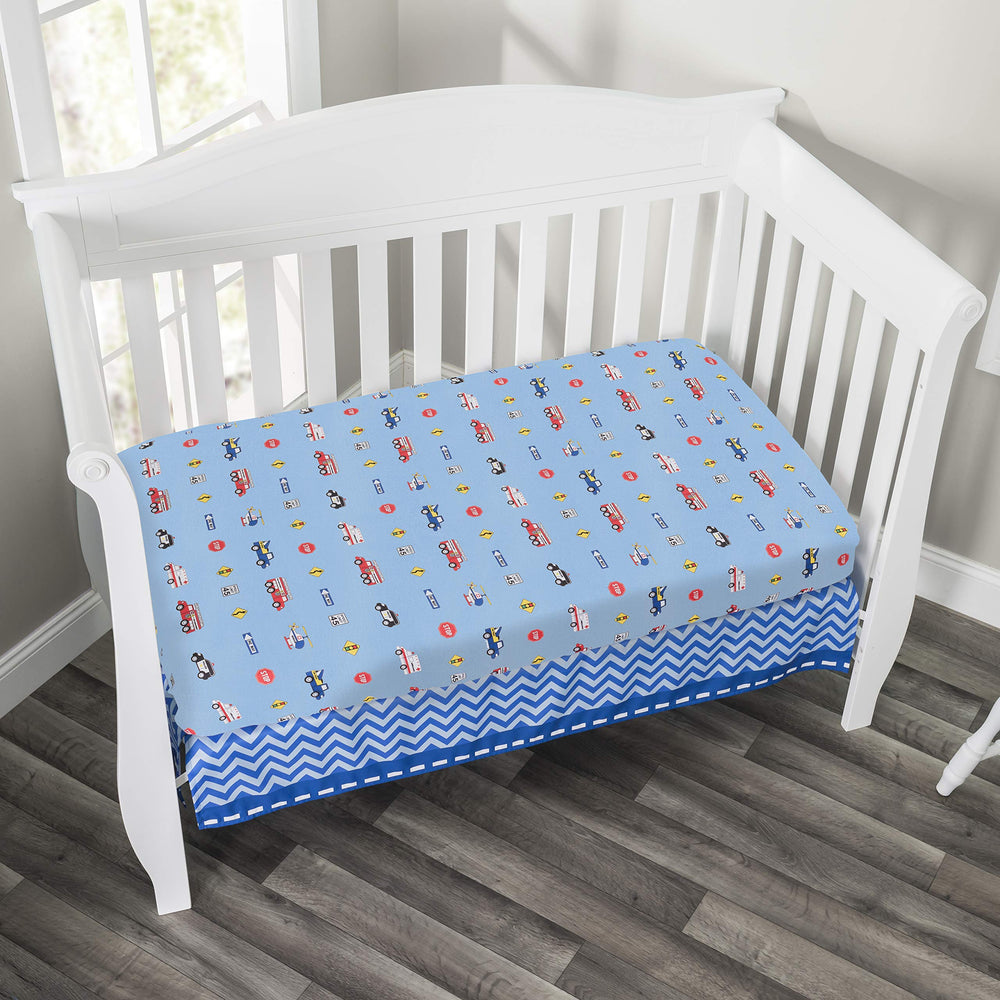Everyday Kids Little Rescuer fitted sheet on crib demonstrates standard crib size fit.
